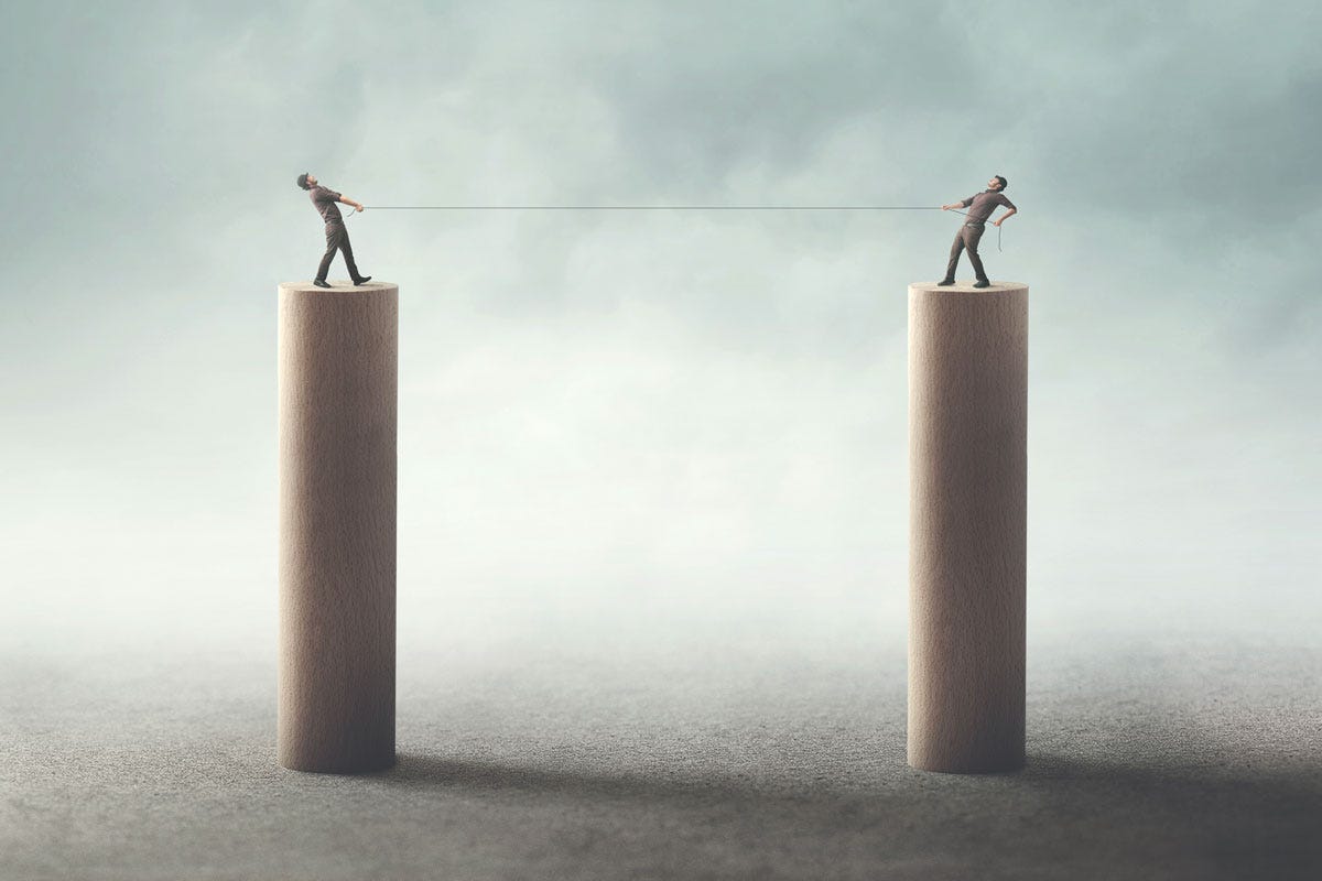 Behind the Scenes: Sparring with the Belligerently Bamboozled; Two People Playing Tug-of-War Standing on Pedestals Behind the Scenes: Sparring with the Belligerently Bamboozled; Two People Playing Tug-of-War Standing on Pedestals