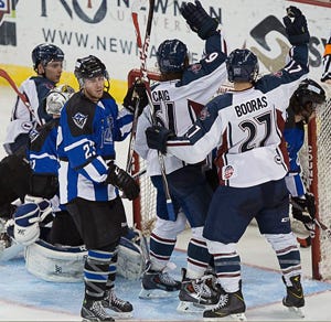 Sticks are raised as TJ Caig scores his second out three goals in a 7-4 Oilers win Saturday night over Wichita. Photo: Ed Bailey Sticks are raised as TJ Caig scores his second out three goals in a 7-4 Oilers win Saturday night over Wichita. Photo: Ed Bailey