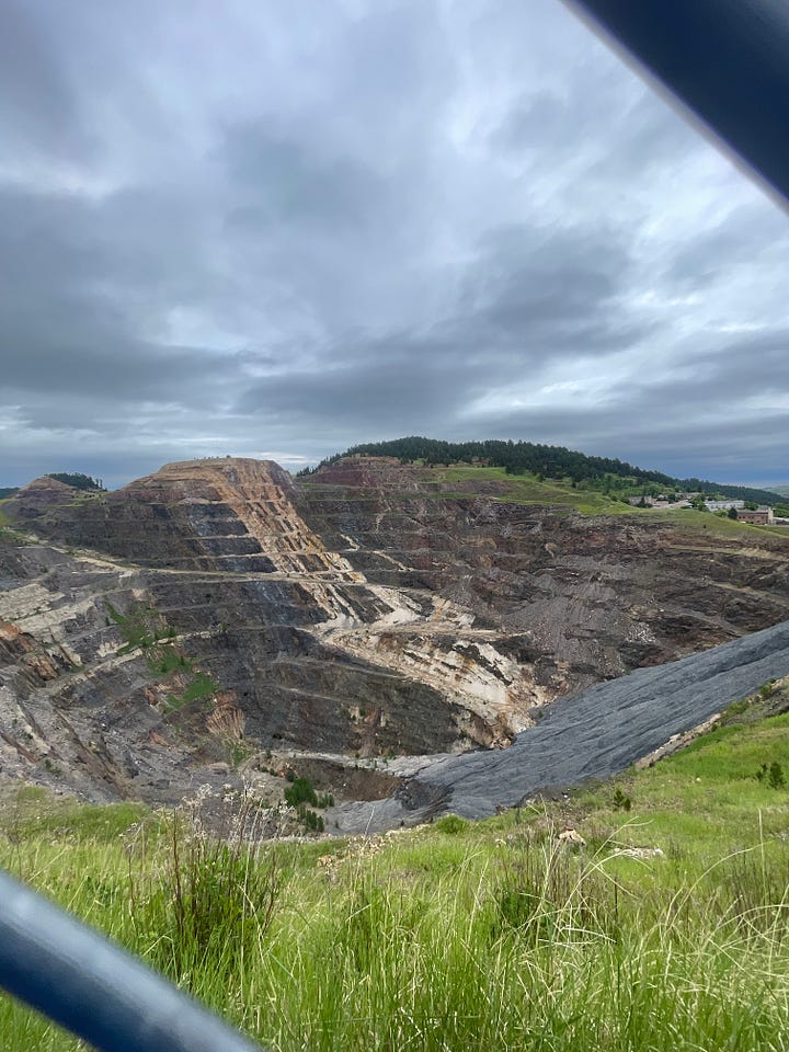 A nice little house with a golf cart in front and another photo of a strip mine.