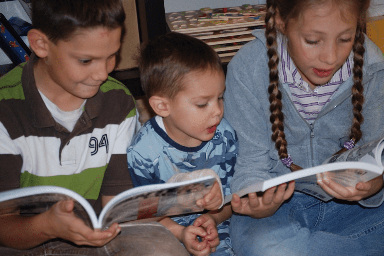 Children reading and loving Jaime Buckley's Wanted Hero comic books