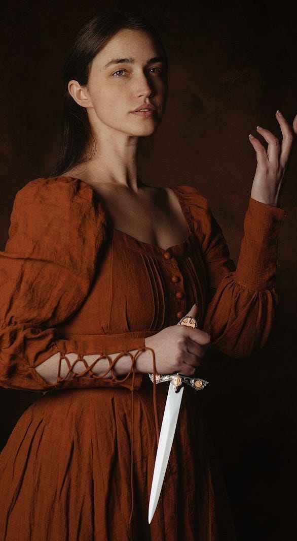 a woman in a brown dress holding a knife