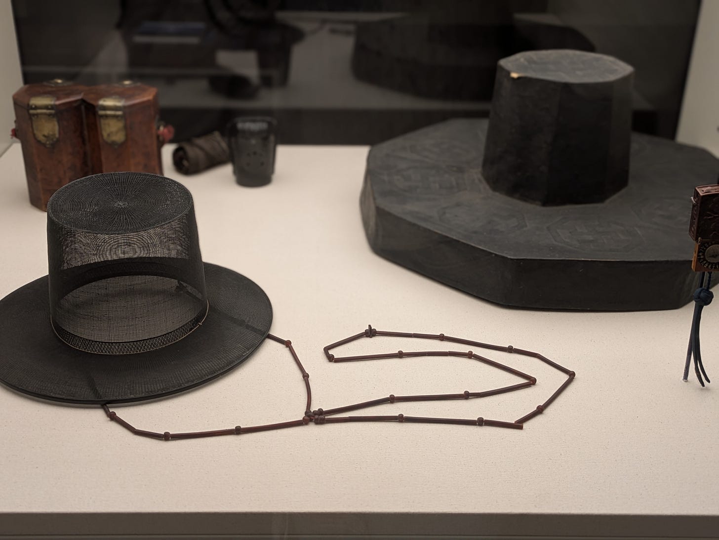 Man’s Hat (Gat) and Case — Joseon dynasty, late 19th century. Horsehair, bamboo, beads. National Museum of Korea. From Lee Kun-Hee Collection. Anyone with a member of gen z or younger in their daily life may recognize this hat.