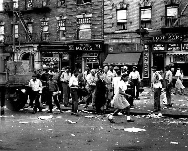 This may contain: an old black and white photo of people on the street