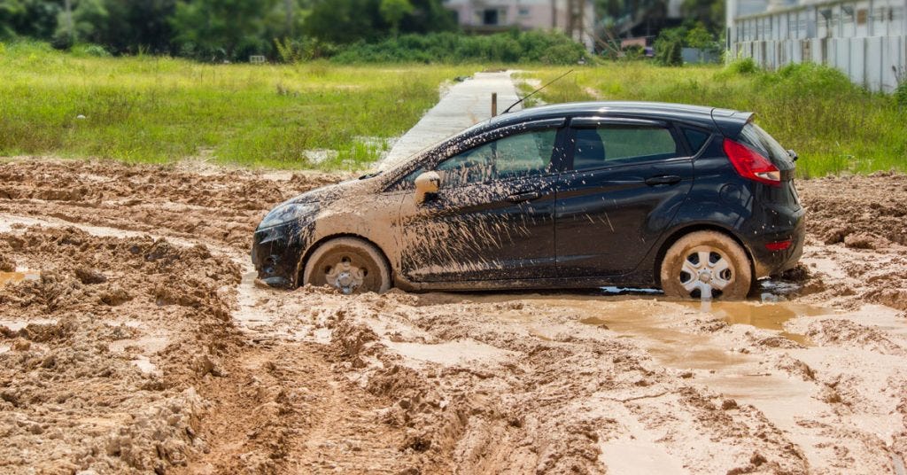 Tips For Recovering a Car Stuck in the Mud | O'Hare Towing Service & Semi  Truck Heavy Duty Wrecker