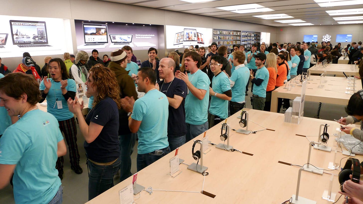 Employees cheer during the 2008 grand reopening of Apple Eaton Centre. Employees cheer during the 2008 grand reopening of Apple Eaton Centre.