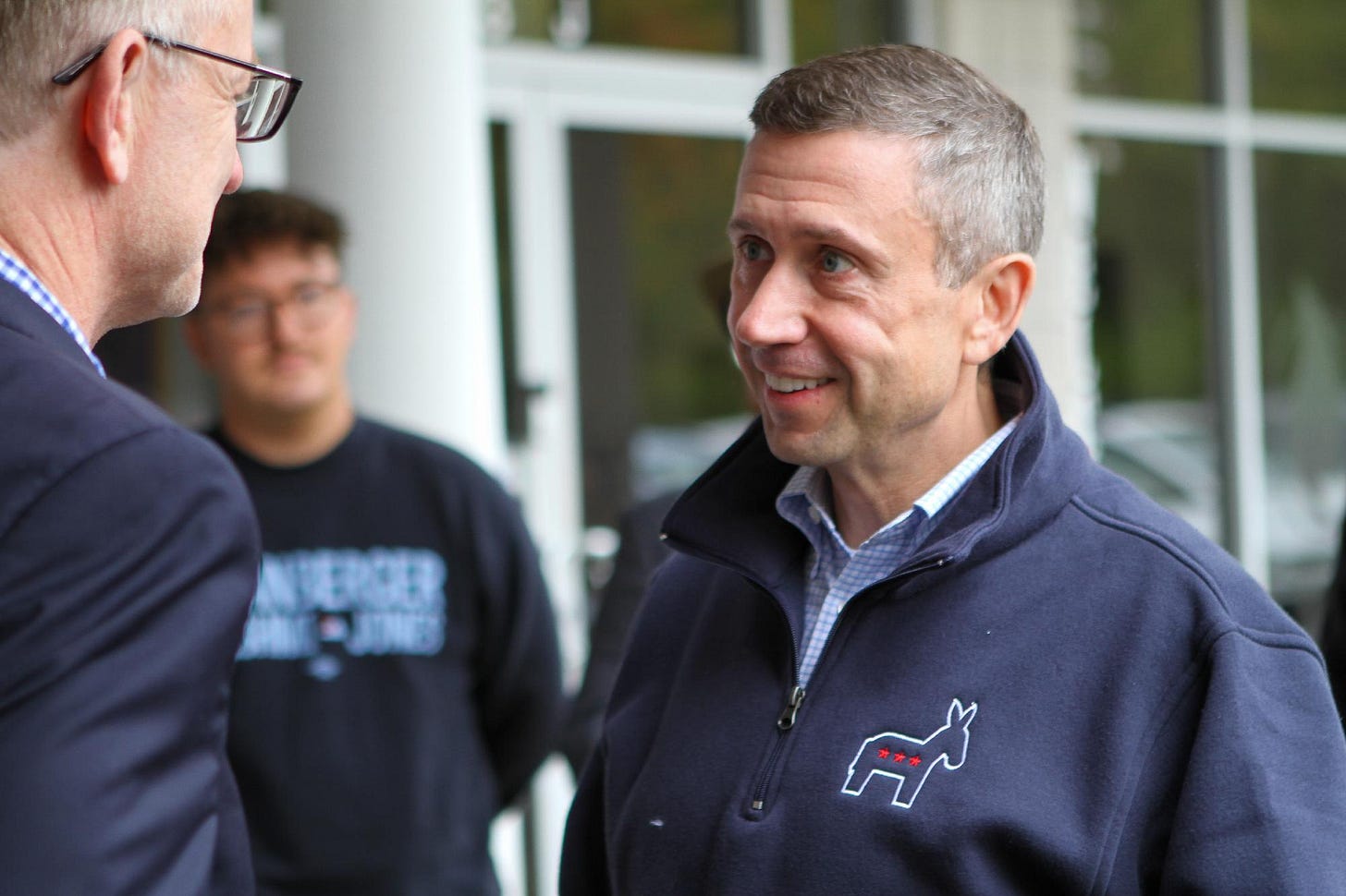 Photo of DNC Chair Ken Martin talking with Virginia Delegate candidate Mark Downey. 