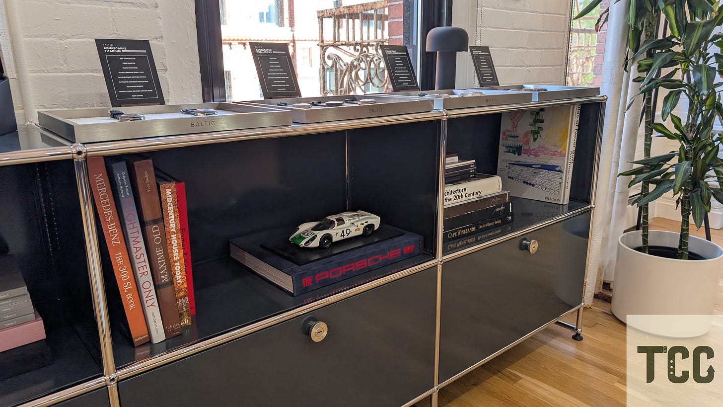 The brand’s watches on top of display cases that double as a bookshelf and storage. 