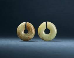 TWO JADE EAR ORNAMENTS, JUE | XINGLONGWA CULTURE, CIRCA 6200-5400 BC | jade/jadeite, China | Christie's TWO JADE EAR ORNAMENTS, JUE | XINGLONGWA CULTURE, CIRCA 6200-5400 BC | jade/jadeite, China | Christie's