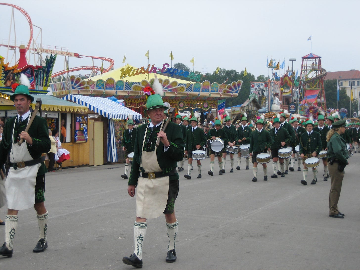 men in traditional dress at a parade at Oktoberfest in Munich