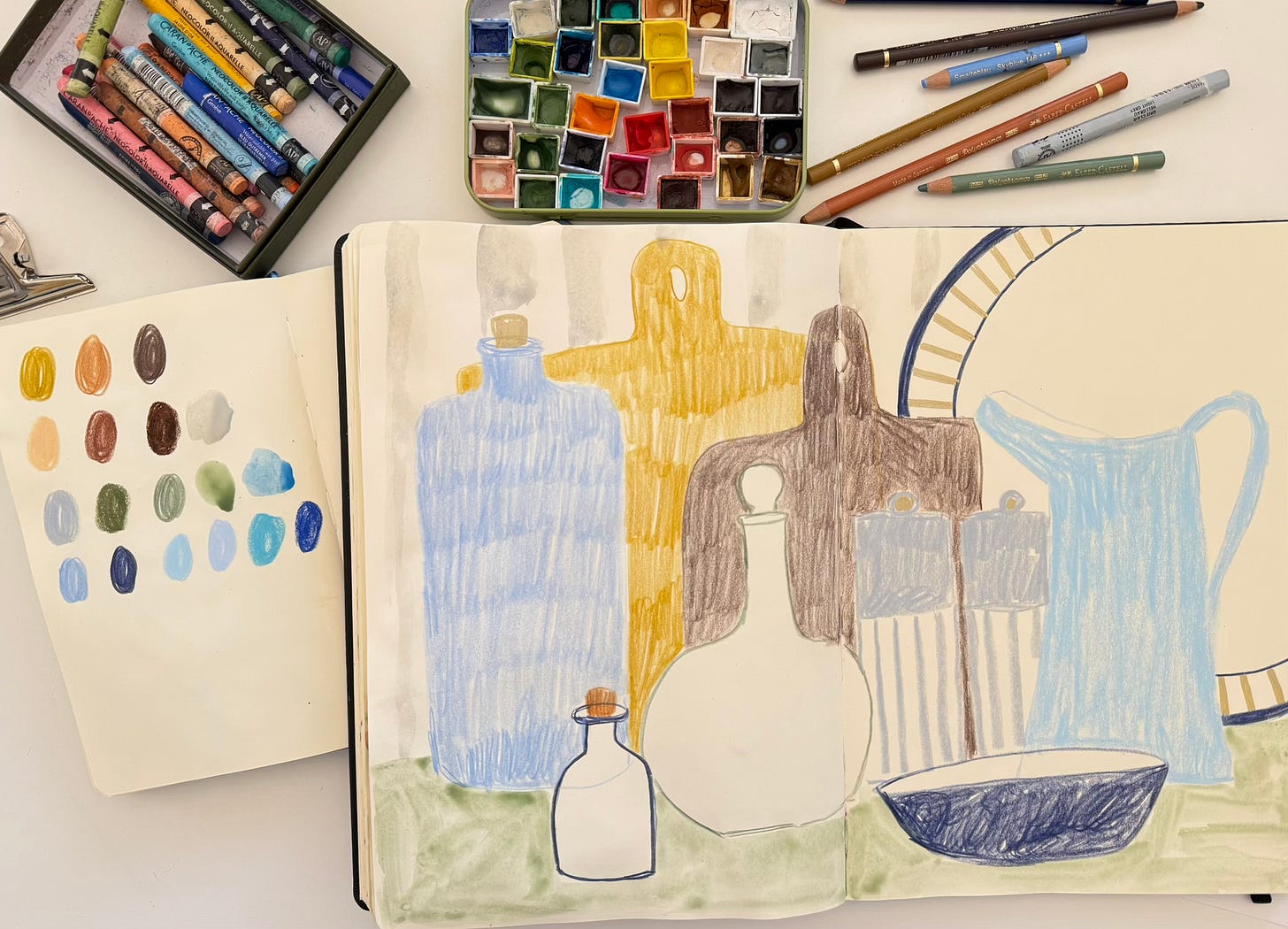 A sketchbook spread with a still life drawing