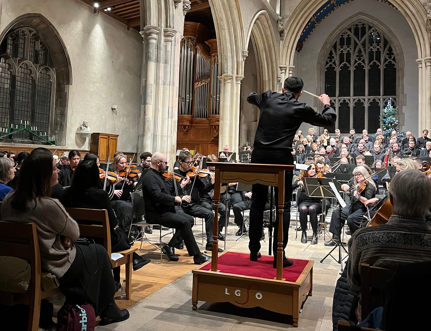 A conductor conducting an orchestra A conductor conducting an orchestra