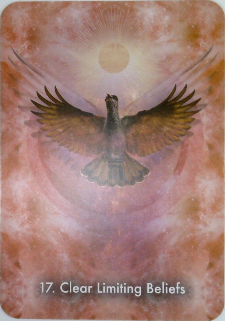 The Sun tarot card and the Clear Limiting Beliefs oracle card.