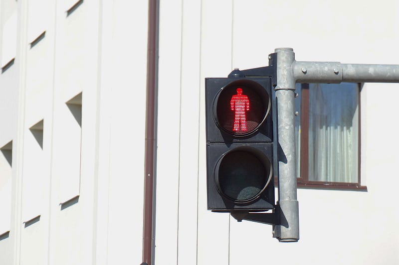 A pedestrian crossing traffic light A pedestrian crossing traffic light