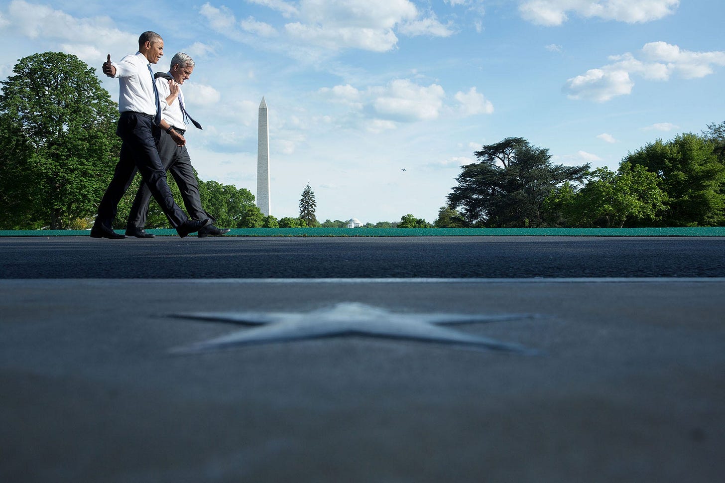 May 13, 2016: President Obama and Chief of Staff Denis McDonough walk along the South Lawn driveway, with a prominent star at the South Portico entrance visible in the foreground. May 13, 2016: President Obama and Chief of Staff Denis McDonough walk along the South Lawn driveway, with a prominent star at the South Portico entrance visible in the foreground.