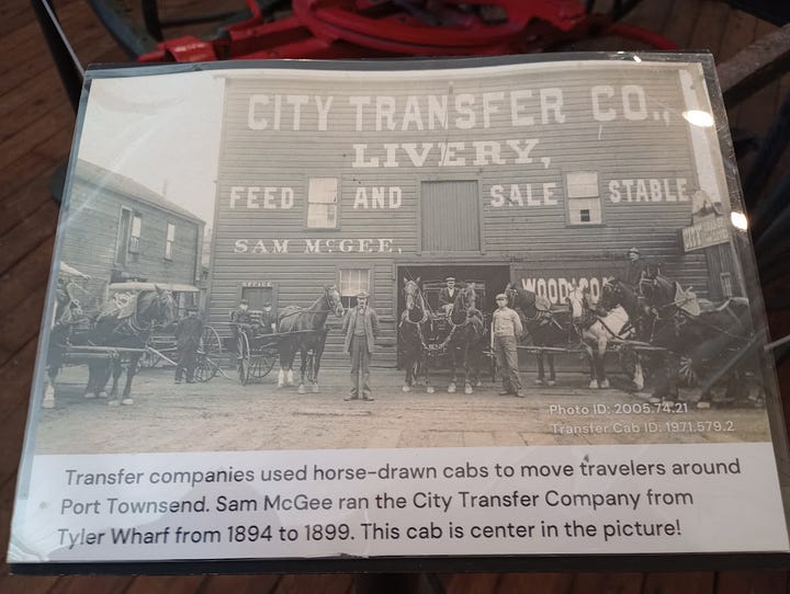 Horse=drawn four-wheel cab, photo of large wooden building with people and horses