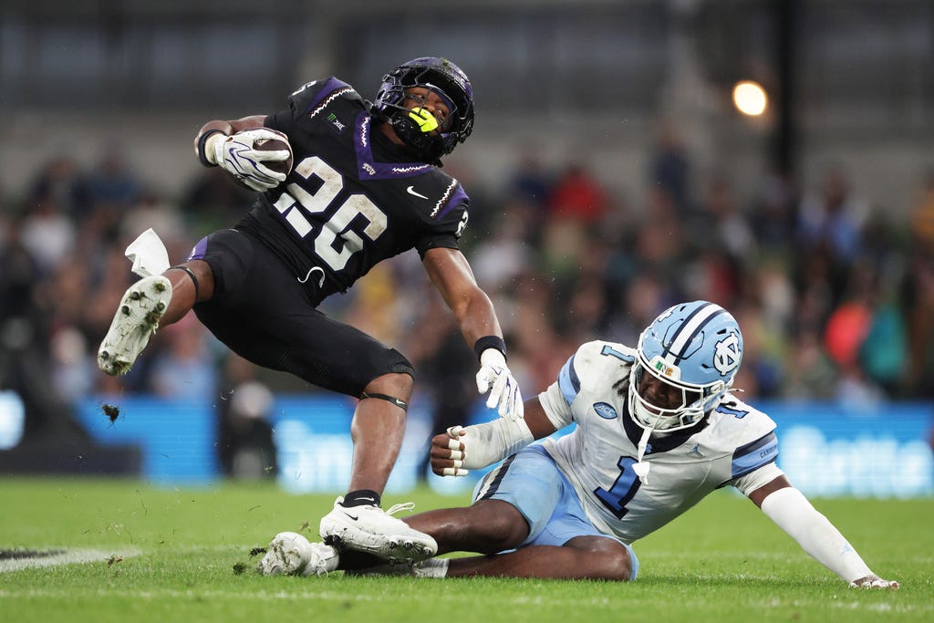 North Carolina's Greg Smith (1) tackles TCU's Jeremy Payne during an NCAA college football game in Dublin, Ireland, Saturday, Aug. 29, 2026. (AP Photo/Peter Morrison) North Carolina's Greg Smith (1) tackles TCU's Jeremy Payne during an NCAA college football game in Dublin, Ireland, Saturday, Aug. 29, 2026. (AP Photo/Peter Morrison)