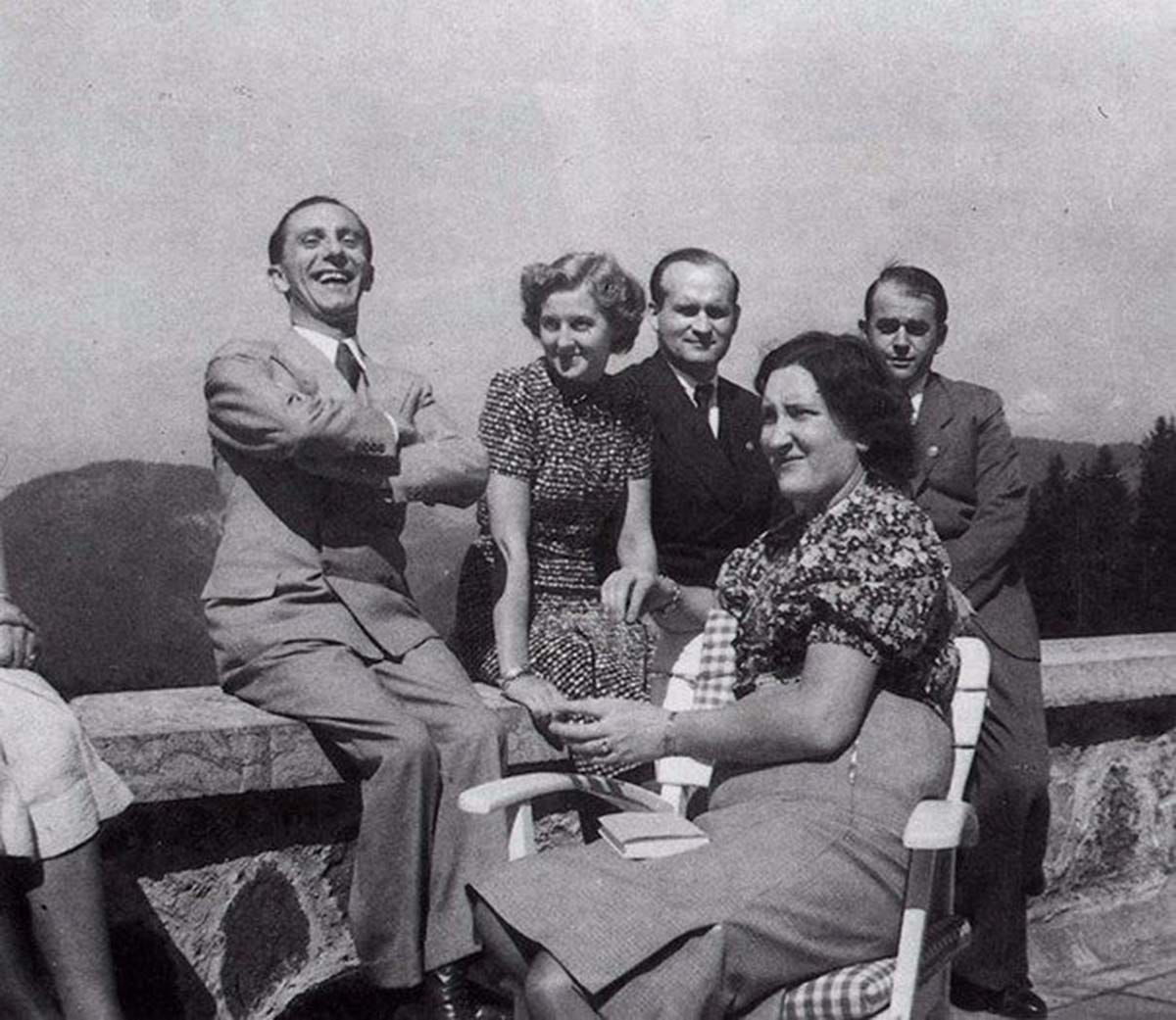 Eva Braun, the lively center of attention, pictured here with Dr. Goebbels and other associates. Albert Speer, reportedly not a fan of Eva, appears somewhat somber in the background. Eva Braun, the lively center of attention, pictured here with Dr. Goebbels and other associates. Albert Speer, reportedly not a fan of Eva, appears somewhat somber in the background.