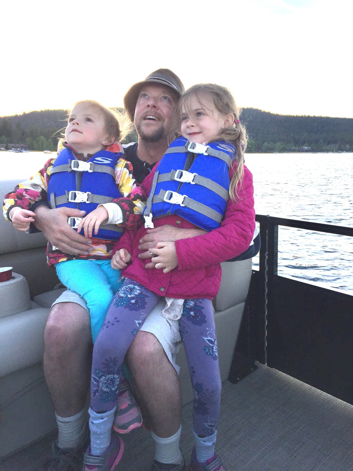 A person and two children on a boat

AI-generated content may be incorrect.