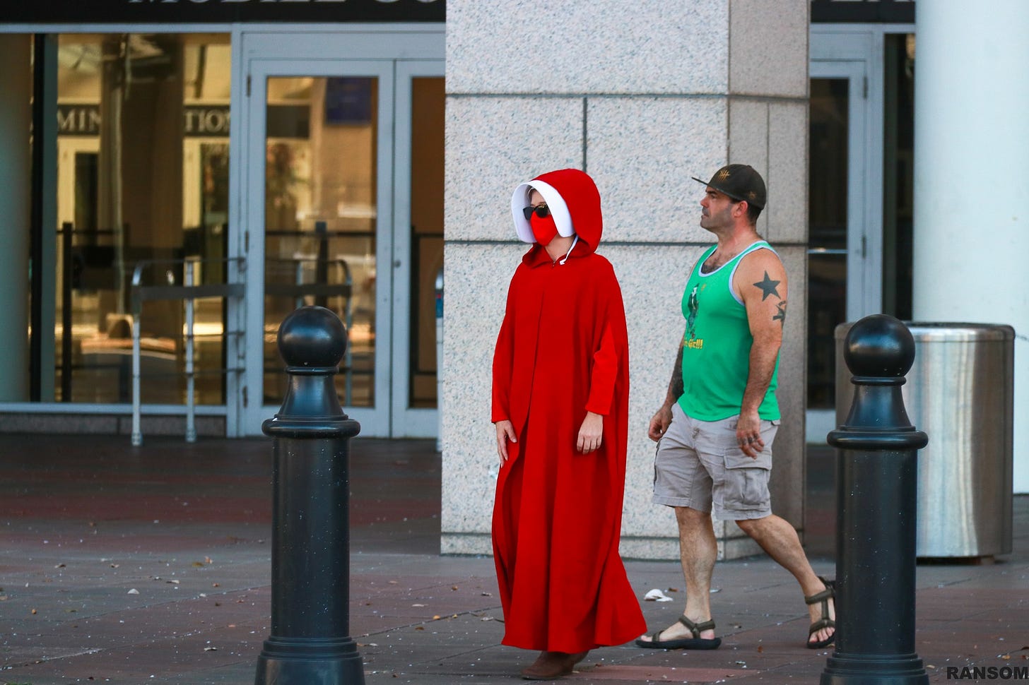 May be an image of one or more people and street