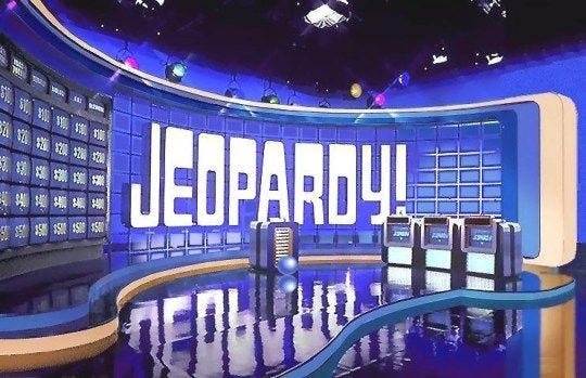 This may contain: an empty stage with the words'jeopardy'on it