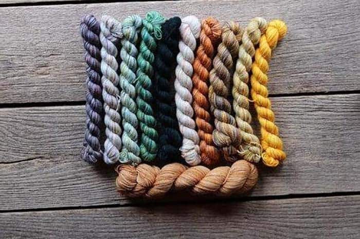 Koigu Galliano Kentia Wrap Kit - Greens, Yellows, Orange, Whites and Browns and the main color of caramel brown. 