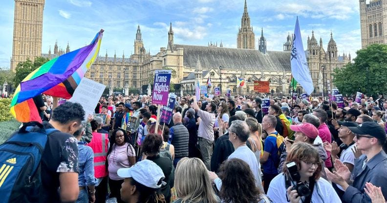 Crowds gathering outside Parliament Square during the Stand Against Suella protest.