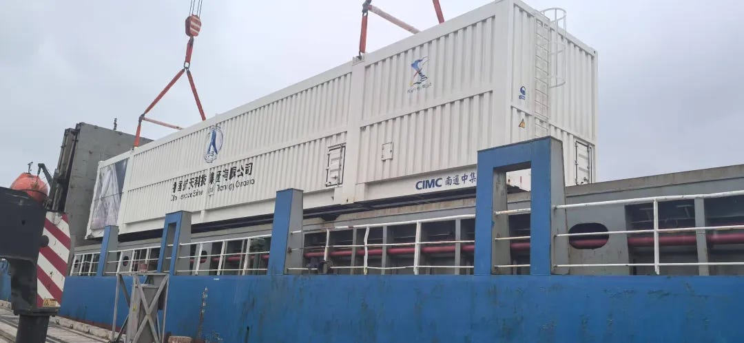 A container containing various stages or boosters of the Long March 8A Y2 vehicle being unloaded after shipment to Wenchang.