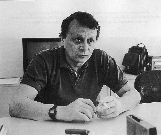 A person sitting at a table

Description automatically generated