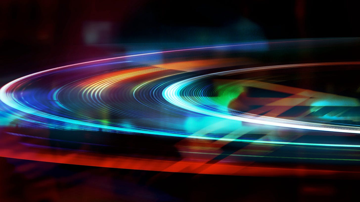 An abstract photo montage of curved light beams against a dark background.