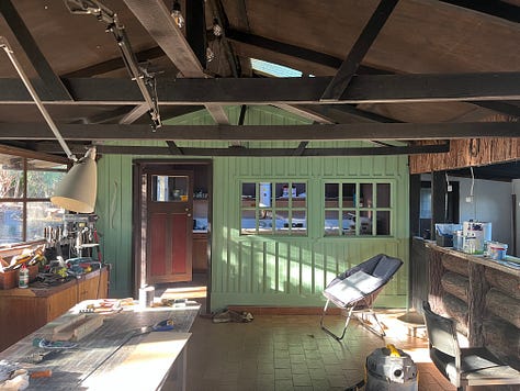 interior photos of an old log cabin with vertical board lining