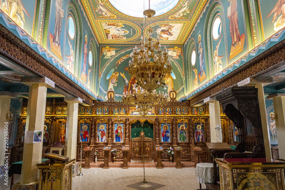 old small Orthodox Christian church inside. grain effect and natural light.  painted in icons and wall paintings church. Stock Photo | Adobe Stock