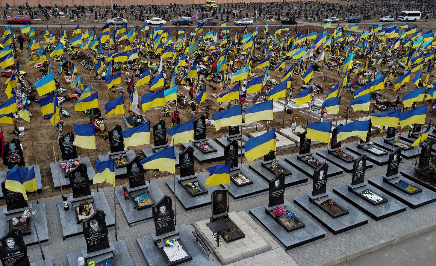 Amid sea of Ukrainian flags, Mariupol defender finally laid to rest |  Reuters