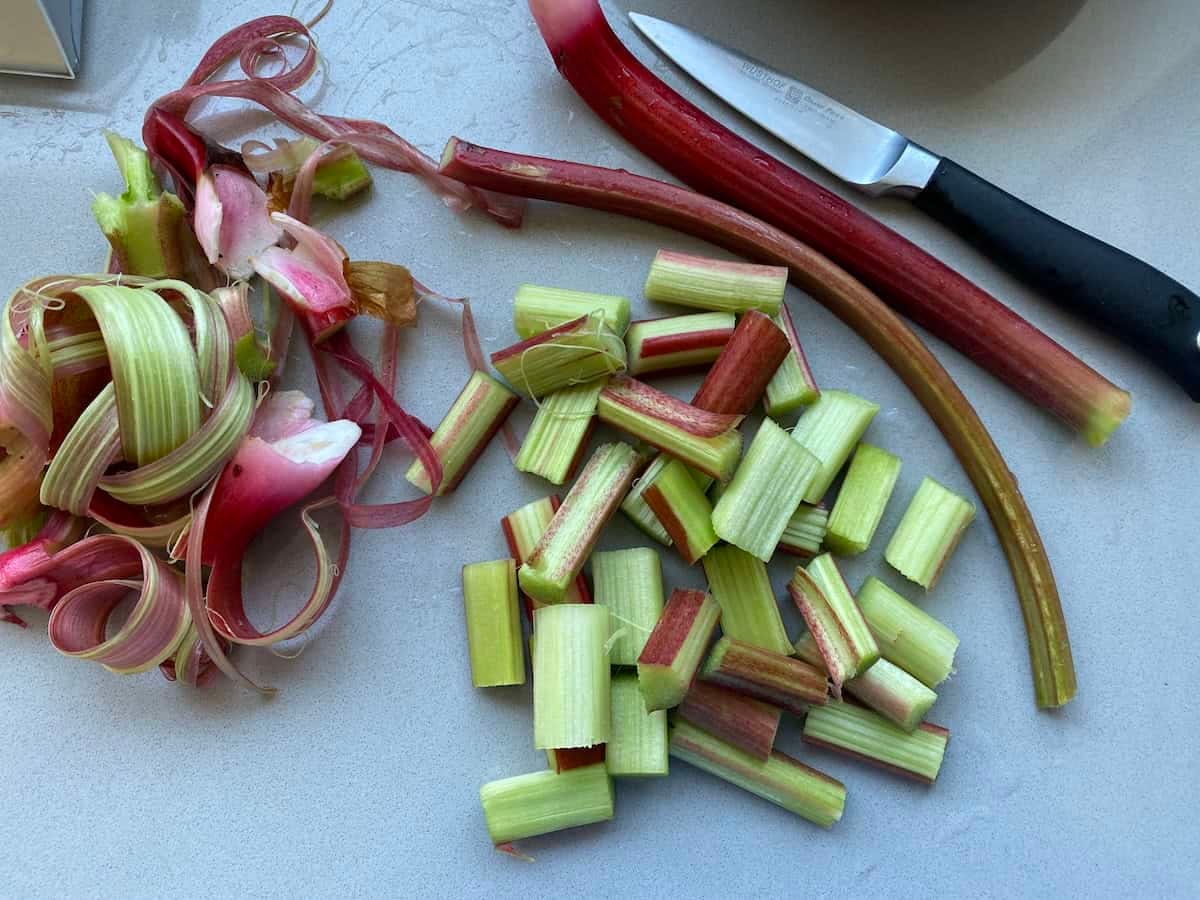 Peeled and chopped Fresh garden rhubarb stalks for traditional British flapjacks. Peeled and chopped Fresh garden rhubarb stalks for traditional British flapjacks.
