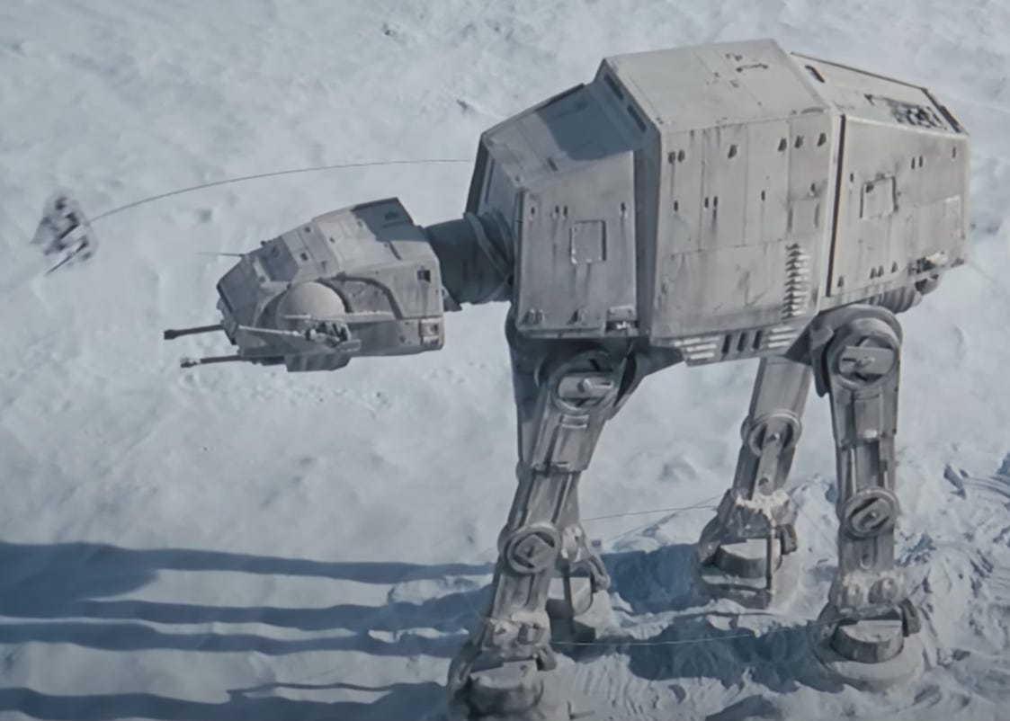 A scene from The Empire Strikes Back, where a small snowspeeder uses a tow cable to trip and defeat a much larger ATAT walker. 