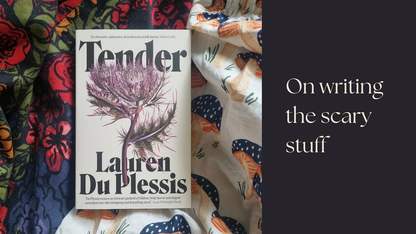A book called 'Tender' laid on crumpled fabric with printed flowers and mushrooms.