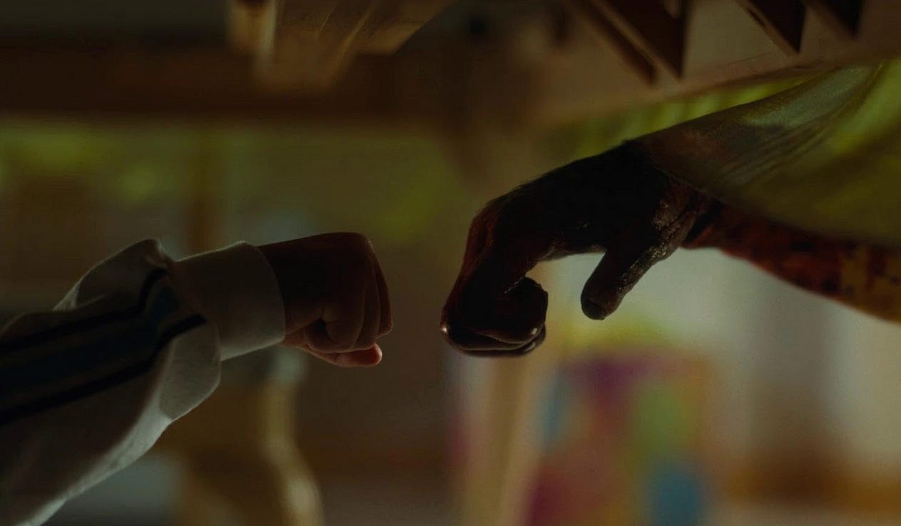 Cryptic image of a chimp and monkey’s hand nearing from the movie ‘Nope’ / Universal Pictures Cryptic image of a chimp and monkey’s hand nearing from the movie ‘Nope’ / Universal Pictures