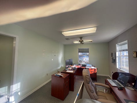 Six photos of the green walls in the office before we got to work painting..