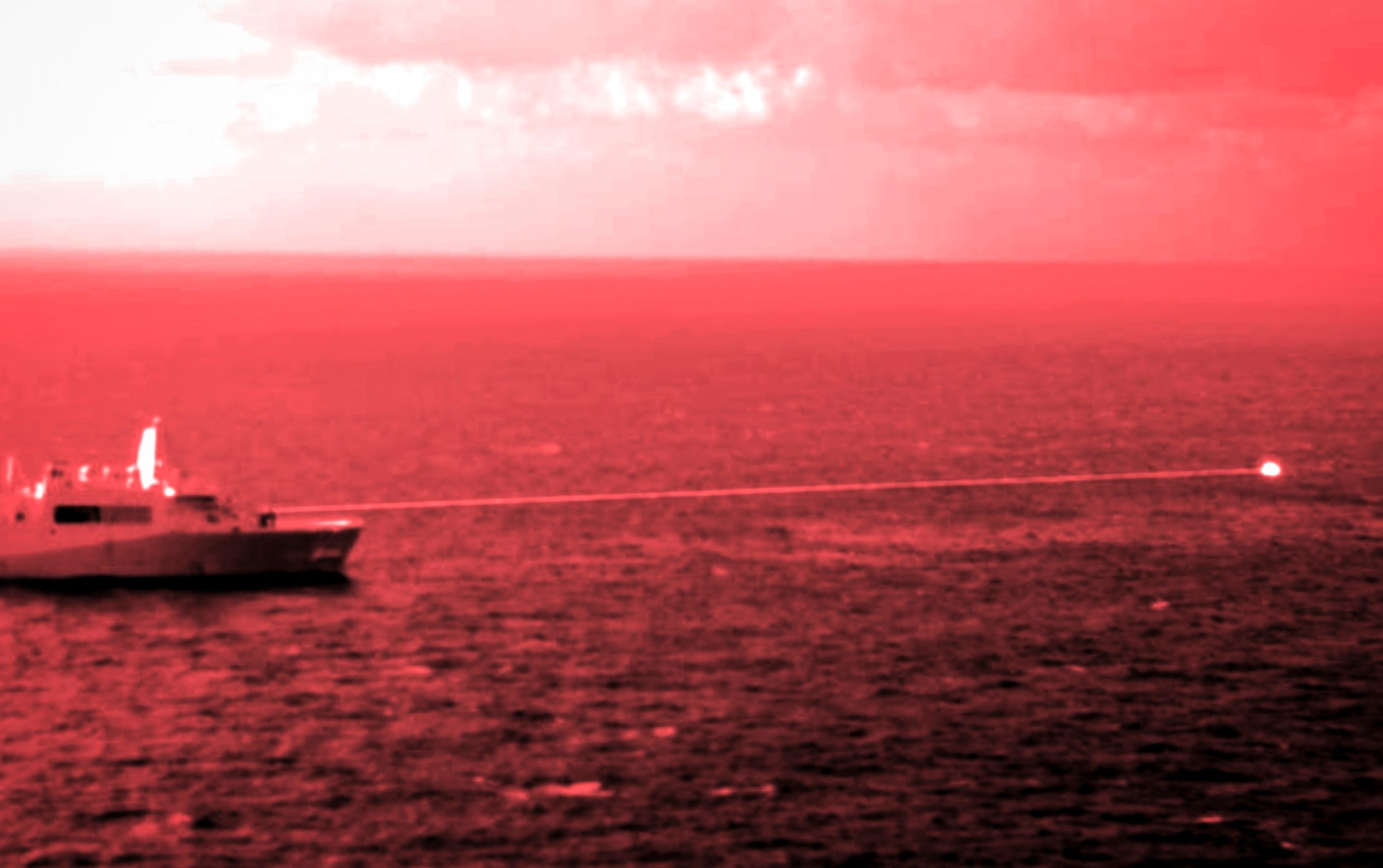 Amphibious transport dock ship USS Portland conducts a high-energy laser weapon system demonstration on a static surface training target while sailing in the Gulf of Aden in December 2021. (US Marine Corps photo) Amphibious transport dock ship USS Portland conducts a high-energy laser weapon system demonstration on a static surface training target while sailing in the Gulf of Aden in December 2021. (US Marine Corps photo)