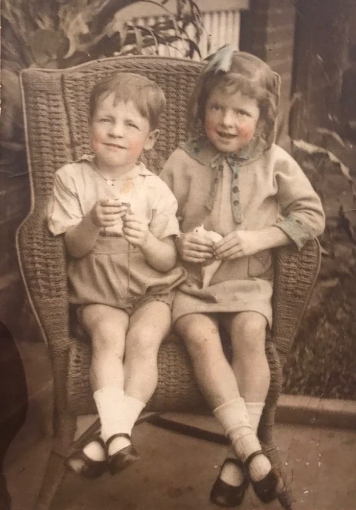 A child and child sitting in a chair

AI-generated content may be incorrect.