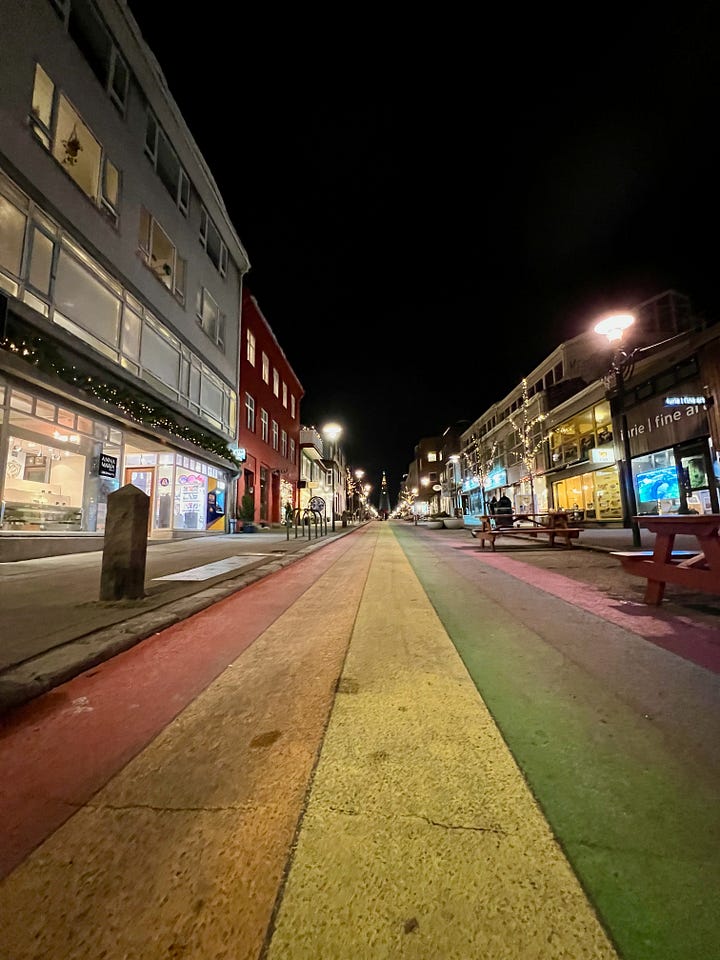 Rainbow Street and single lane road with commercial and residential