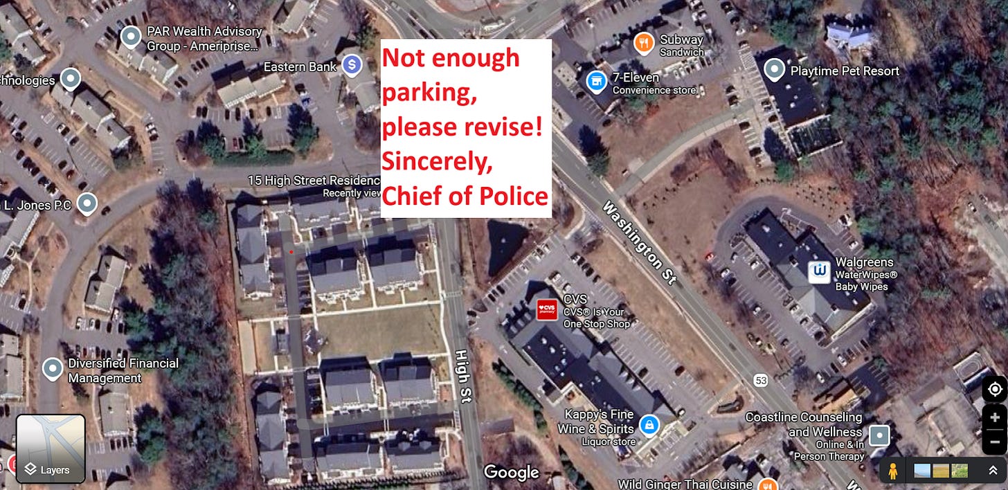 Overhead from (screenshot of Google Maps) of an apartment building surrounded to the north, east, and west with commerical spaces and office buildings, all with a lot of spare parking. In red text I wrote "Not enough parking, please revise! Sincerely, Chief of Police"