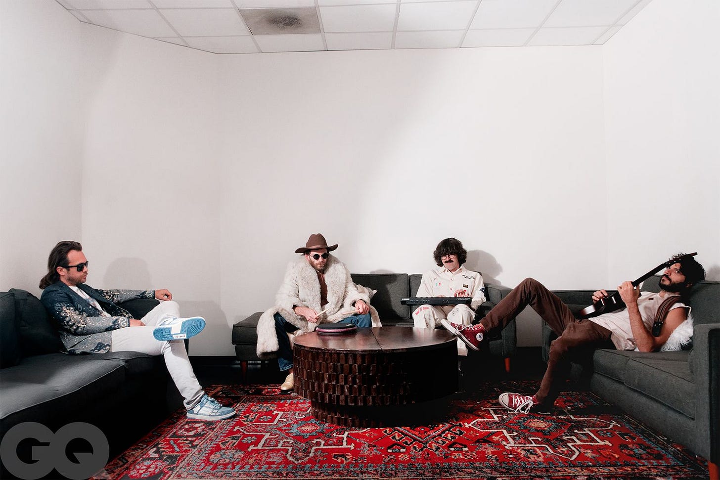 Image may contain Charly García Clothing Footwear Shoe Person Adult Hat People Couch Furniture Home Decor and Rug