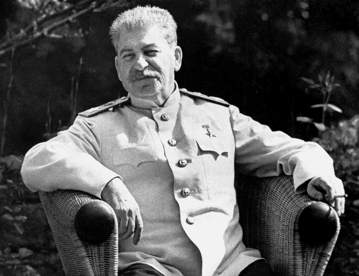 A contemplative 66-year-old Joseph Stalin, smoking a cigarette, during the crucial Potsdam Conference in 1945.