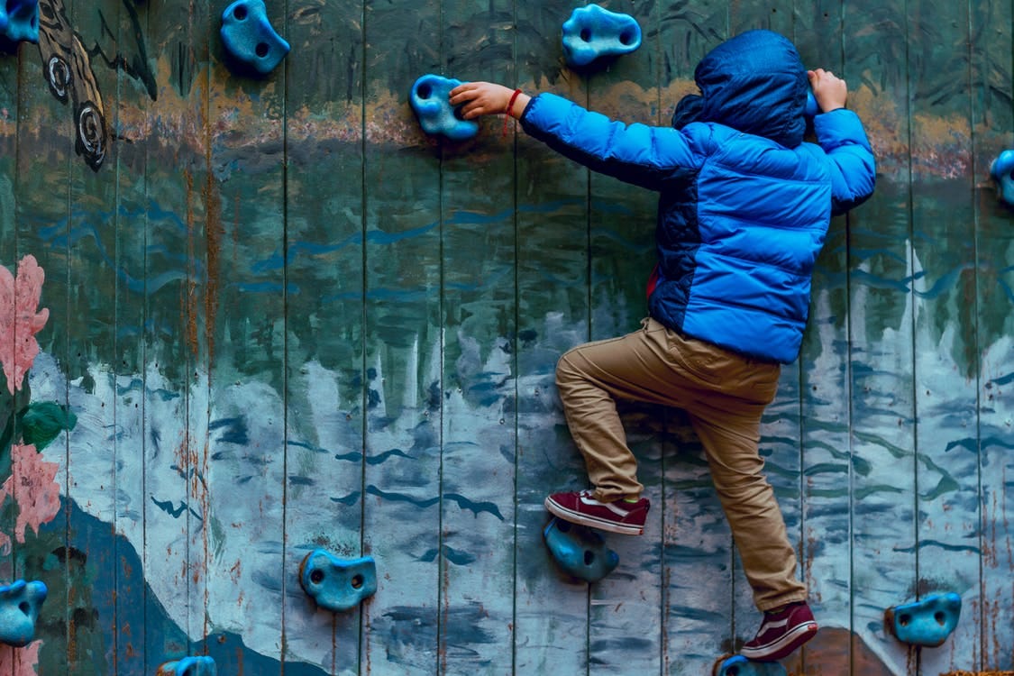 Photo of Boy Wall Climbing Photo of Boy Wall Climbing