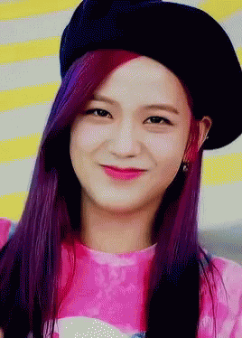 a woman with purple hair wearing a black hat