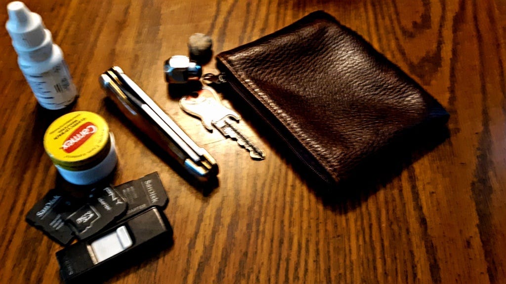 Most of the objects in my pouch. I actually carry several... Too embarrassed to mention in text. 