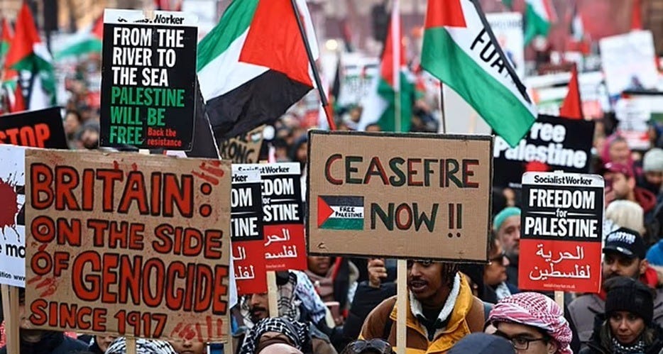 Crowds at the Together Alliance march in central London on 28 March 2026, holding placards reading "From the River to the Sea, Palestine Will Be Free," "Britain: On the Side of Genocide Since 1917," and "Ceasefire Now," alongside Palestinian flags and Socialist Worker "Freedom for Palestine" signs - https://bit.ly/3O5HJU4 Crowds at the Together Alliance march in central London on 28 March 2026, holding placards reading "From the River to the Sea, Palestine Will Be Free," "Britain: On the Side of Genocide Since 1917," and "Ceasefire Now," alongside Palestinian flags and Socialist Worker "Freedom for Palestine" signs - https://bit.ly/3O5HJU4