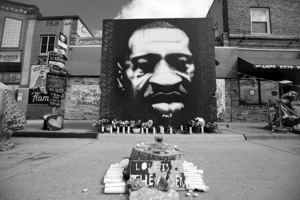 A portrait of George Floyd by Peyton Scott Russell at East 38th Street and Chicago Avenue in Minneapolis, Minnesota A portrait of George Floyd by Peyton Scott Russell at East 38th Street and Chicago Avenue in Minneapolis, Minnesota