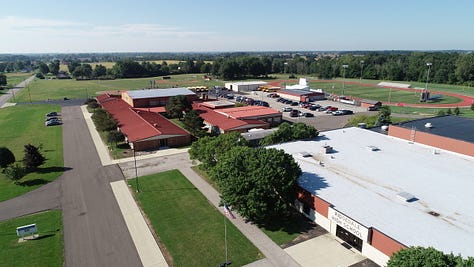 Ariel view of Ridgedale, the R logo with a rocket and Don
