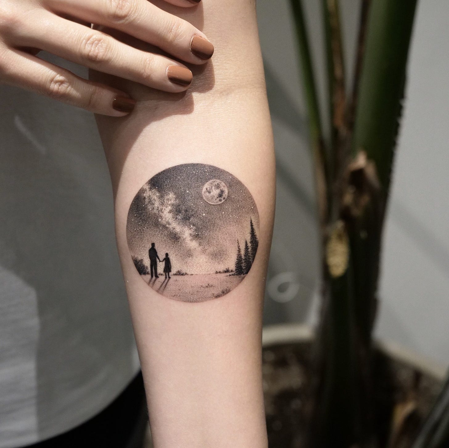 a person's arm with a tattoo on it
